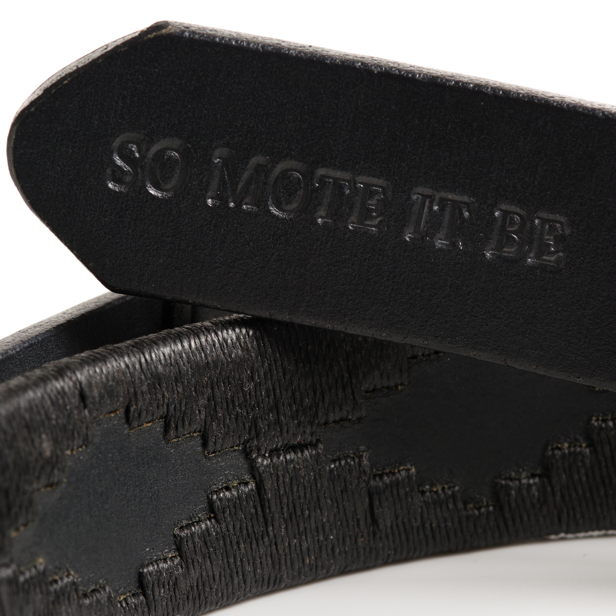 Close-up of the Freemasons leather polo belt leather and stitching detail