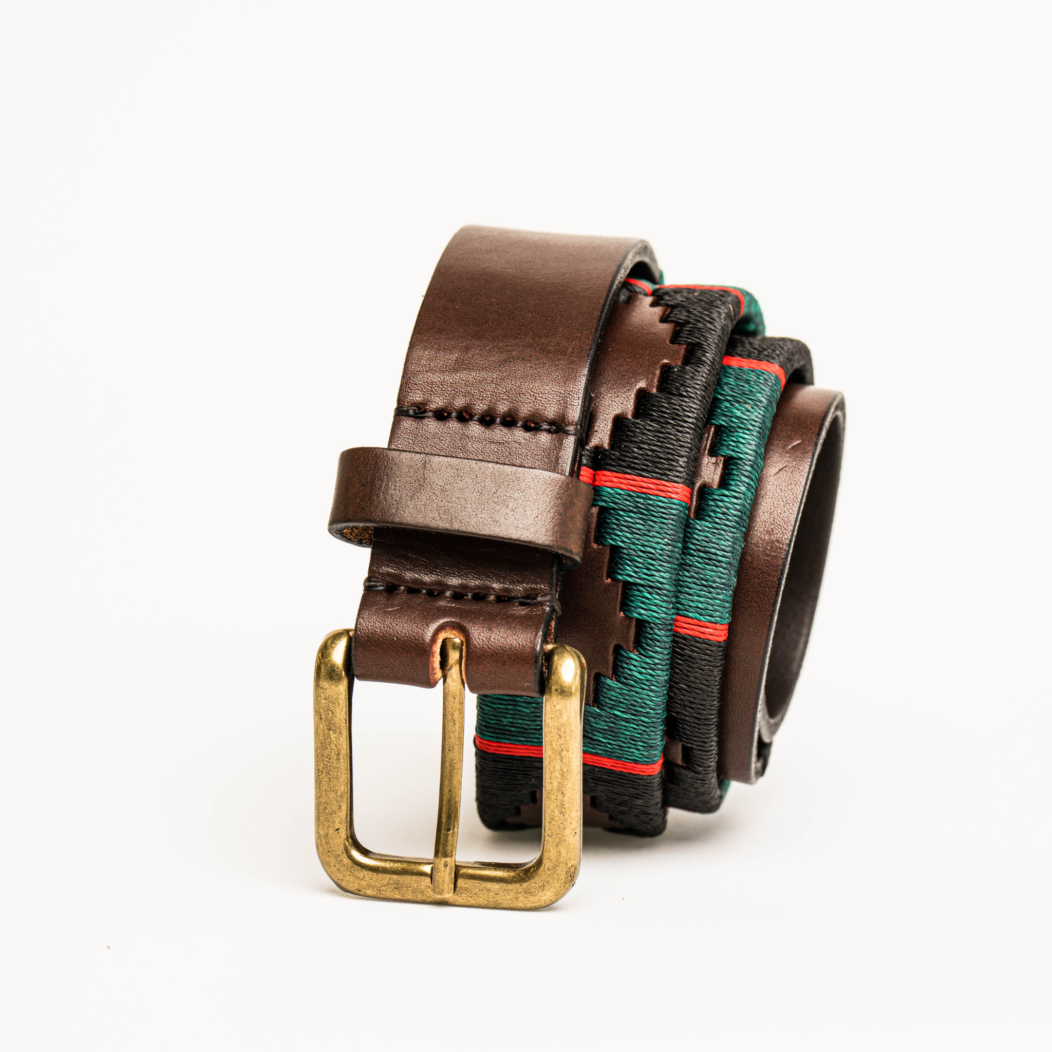 Close-up highlighting the buckle of the Country Direct & Pampeano Royal Gurkha Rifles Leather Polo, featuring red, green, and black wax thread detailing.