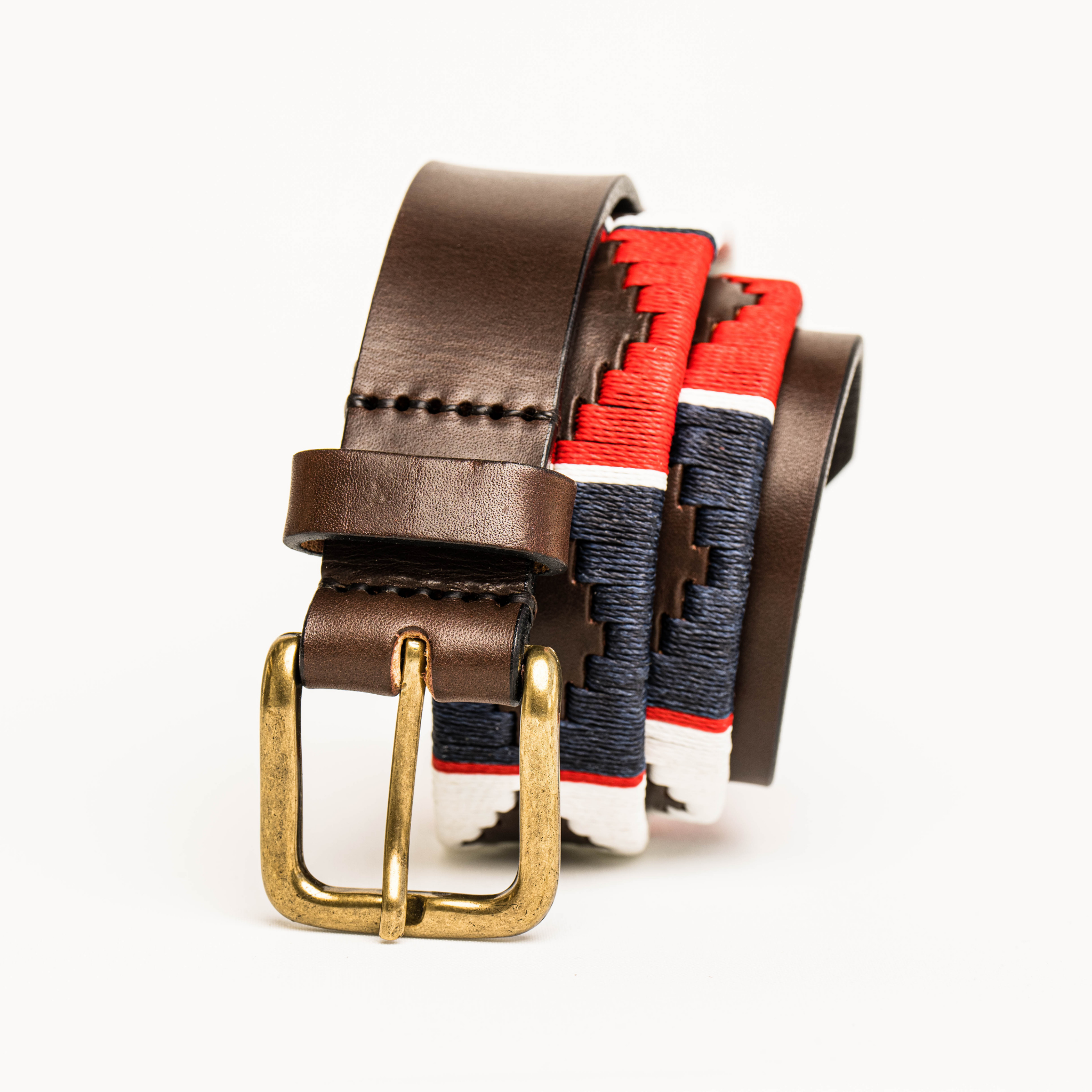 Close-up highlighting the buckle of the Country Direct & Pampeano Royal Navy Leather Polo Belt, featuring navy-blue, red, and white wax thread detailing.